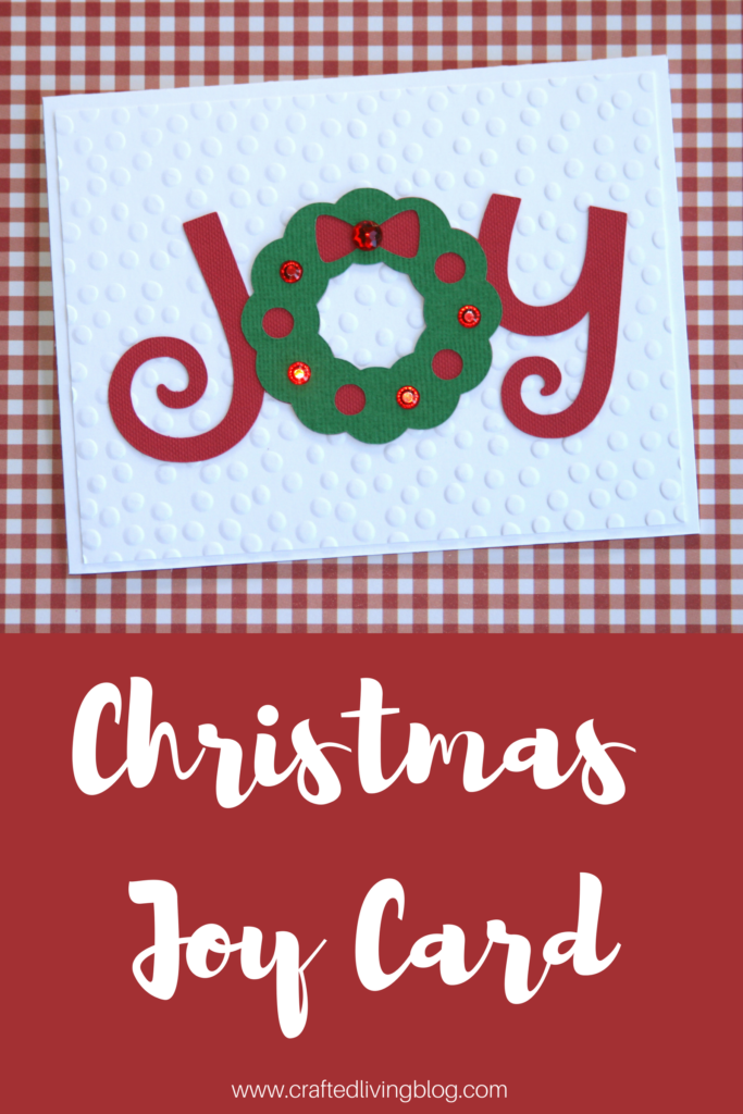 Make this easy DIY Christmas card using your Cricut. By following the simple step-by-step tutorial, you'll have a beautiful handmade card to give at Christmas. #craftedliving #christmascards #christmascrafts #diychristmas #christmas 