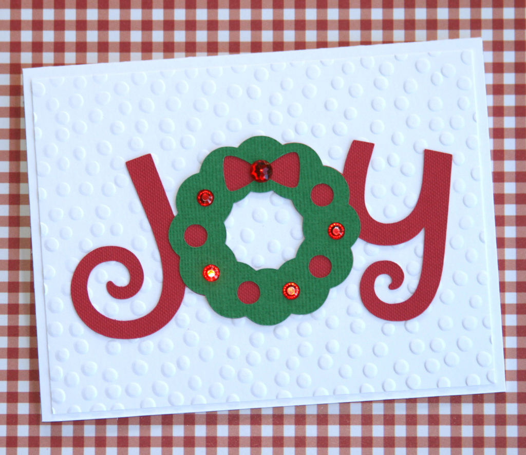 Make this easy DIY Christmas card using your Cricut. By following the simple step-by-step tutorial, you'll have a beautiful handmade card to give at Christmas. #craftedliving #christmascards #christmascrafts #diychristmas #christmas