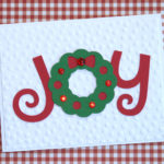 Make this easy DIY Christmas card using your Cricut. By following the simple step-by-step tutorial, you'll have a beautiful handmade card to give at Christmas. #craftedliving #christmascards #christmascrafts #diychristmas #christmas