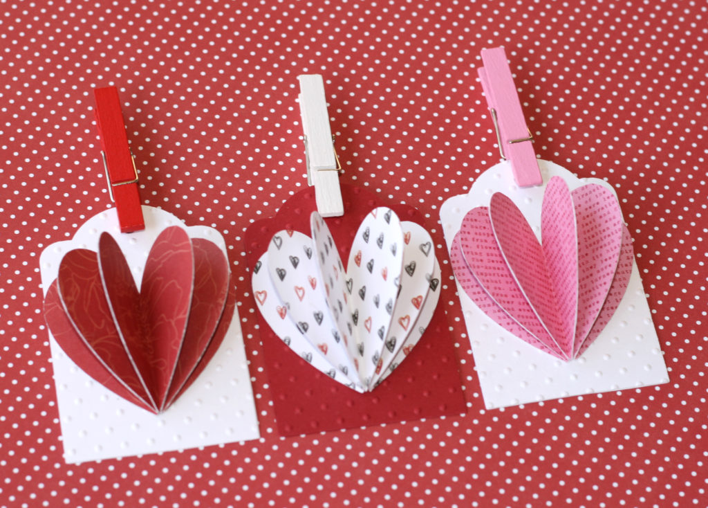 Celebrate love by making these easy DIY heart tags using your favorite paper. Fun idea to add to your Valentine's Day or Galentine's Day treats to make them extra special. #craftedliving #valentinesday #galentine #diycrafts
