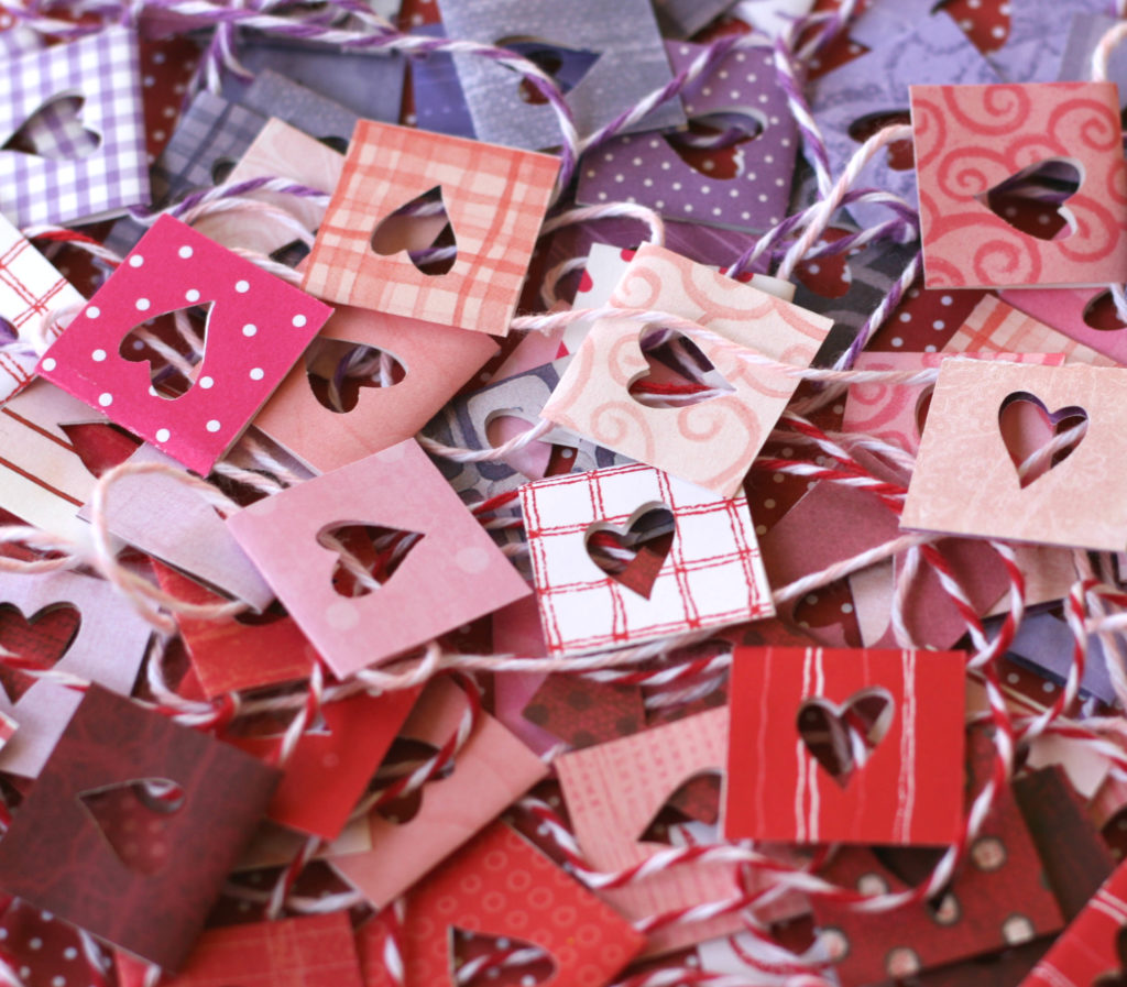 Celebrate Valentine’s Day by creating this easy DIY hearts garland. Make it using your favorite paper to add playful style to your celebration. #craftedliving #valentinesday #galentine #diycrafts